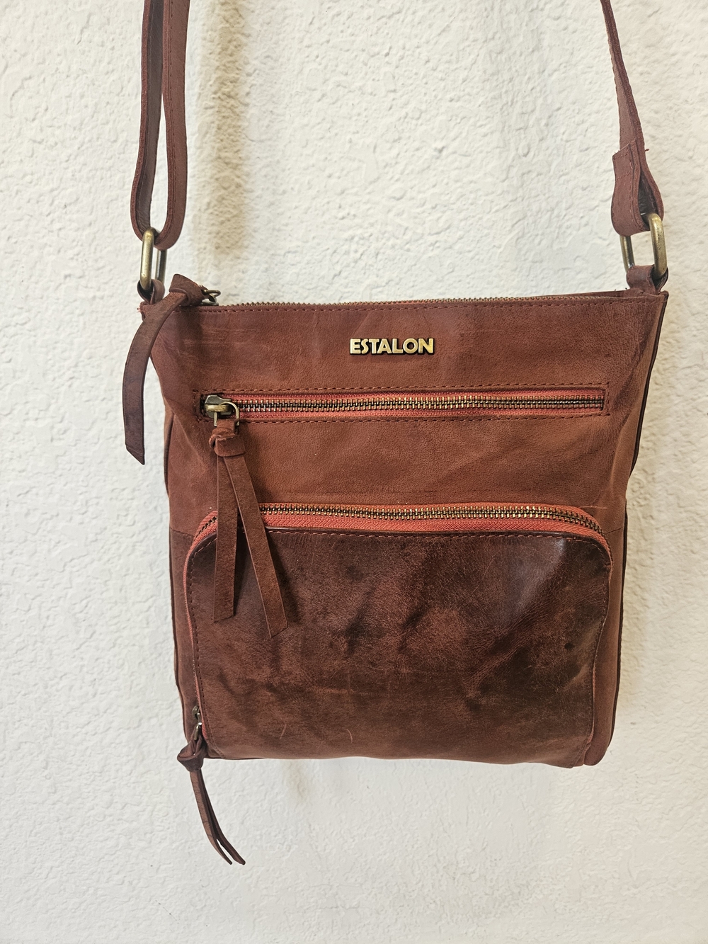 Estalon genuine leather crossbody bag in a rustic, distressed rust-brown color